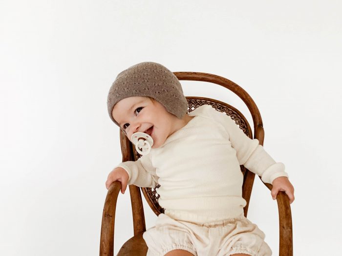 cute baby wearing merino wool vid hat