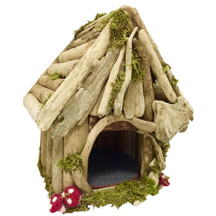 woodland fairy house with moss and mushrooms