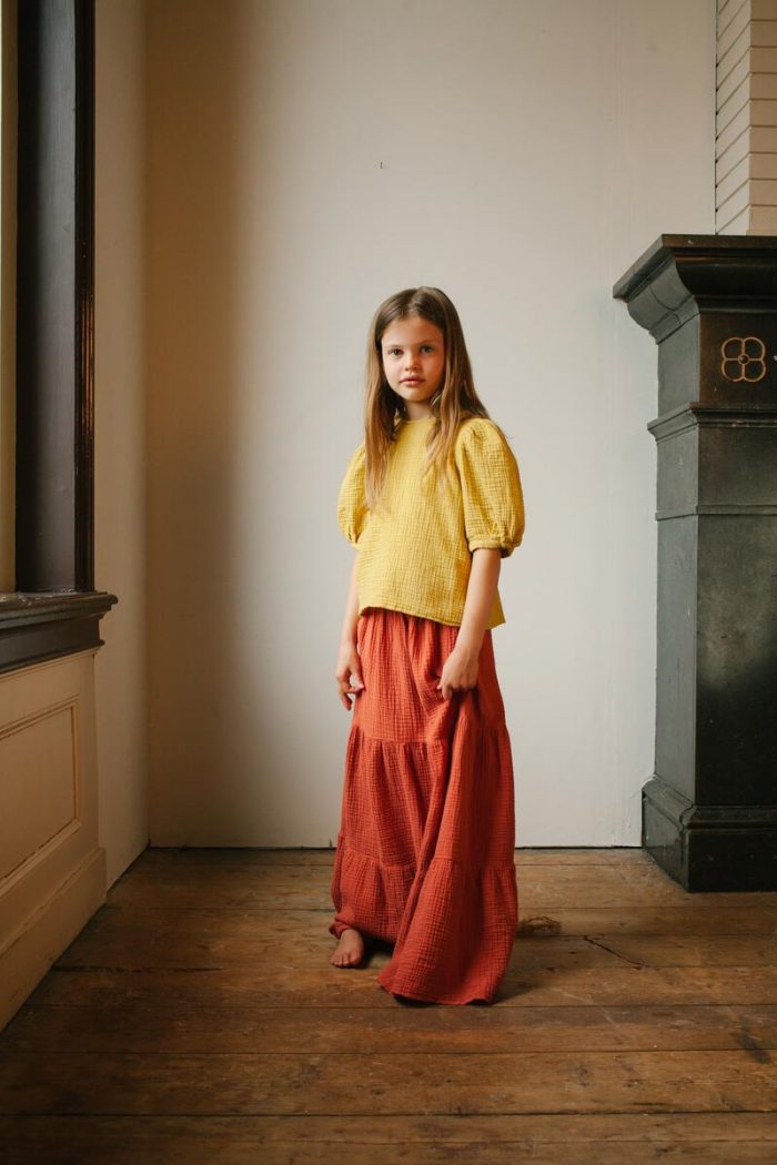 Sara top mellow yellow model and Mio maxi skirt rusty red